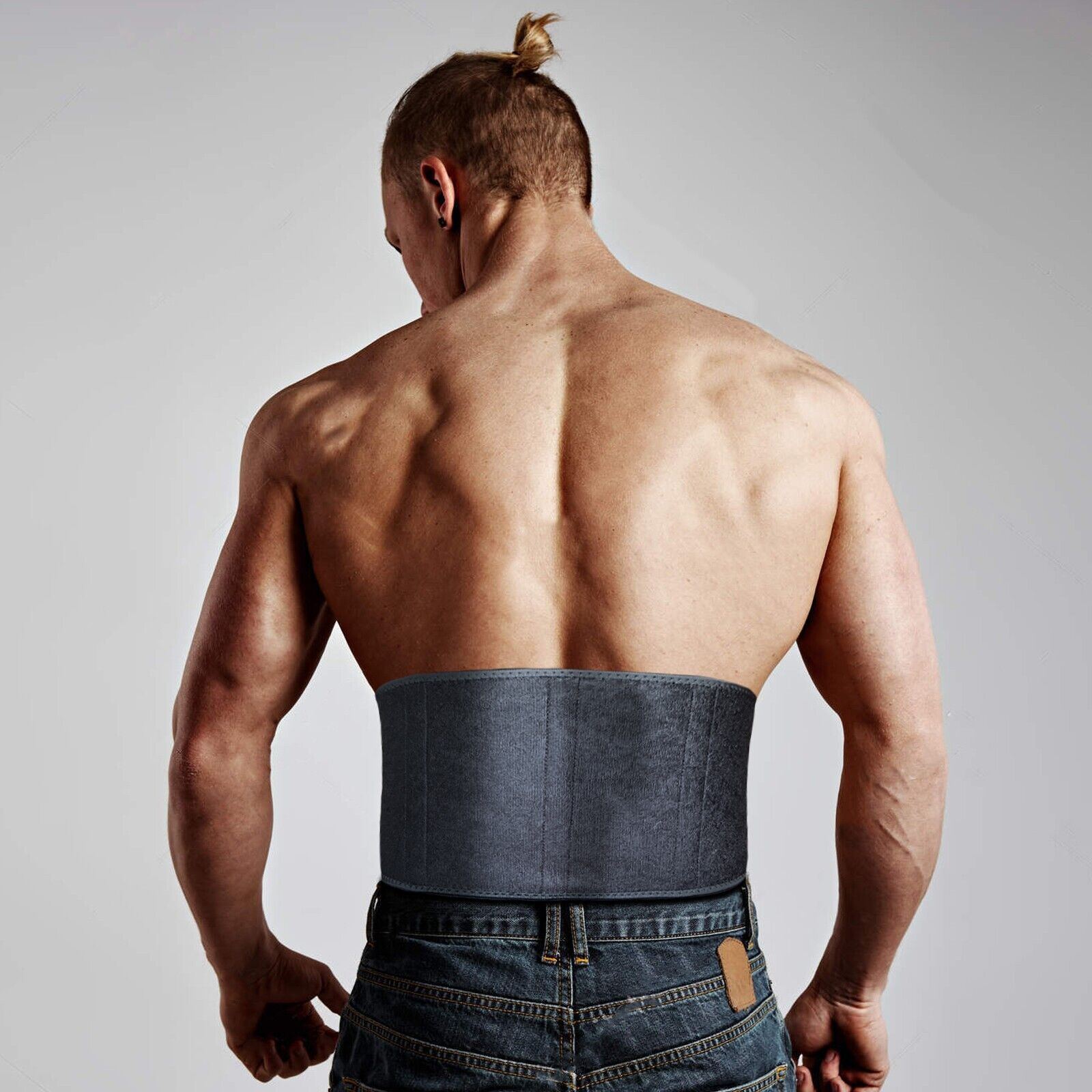 Male athlete wearing a back support belt