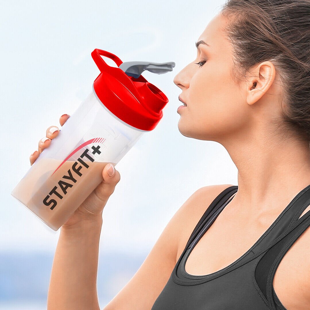 Female athlete drinking from a shaker bottle