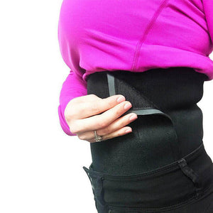 Female putting on a waist trimmer