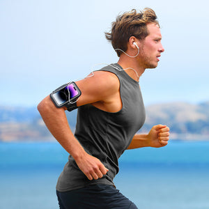 Male athlete running with a black phone armband