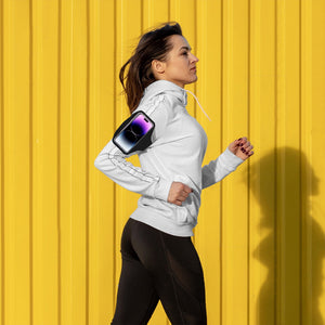 Female runner outside with a fitness armband around her arm