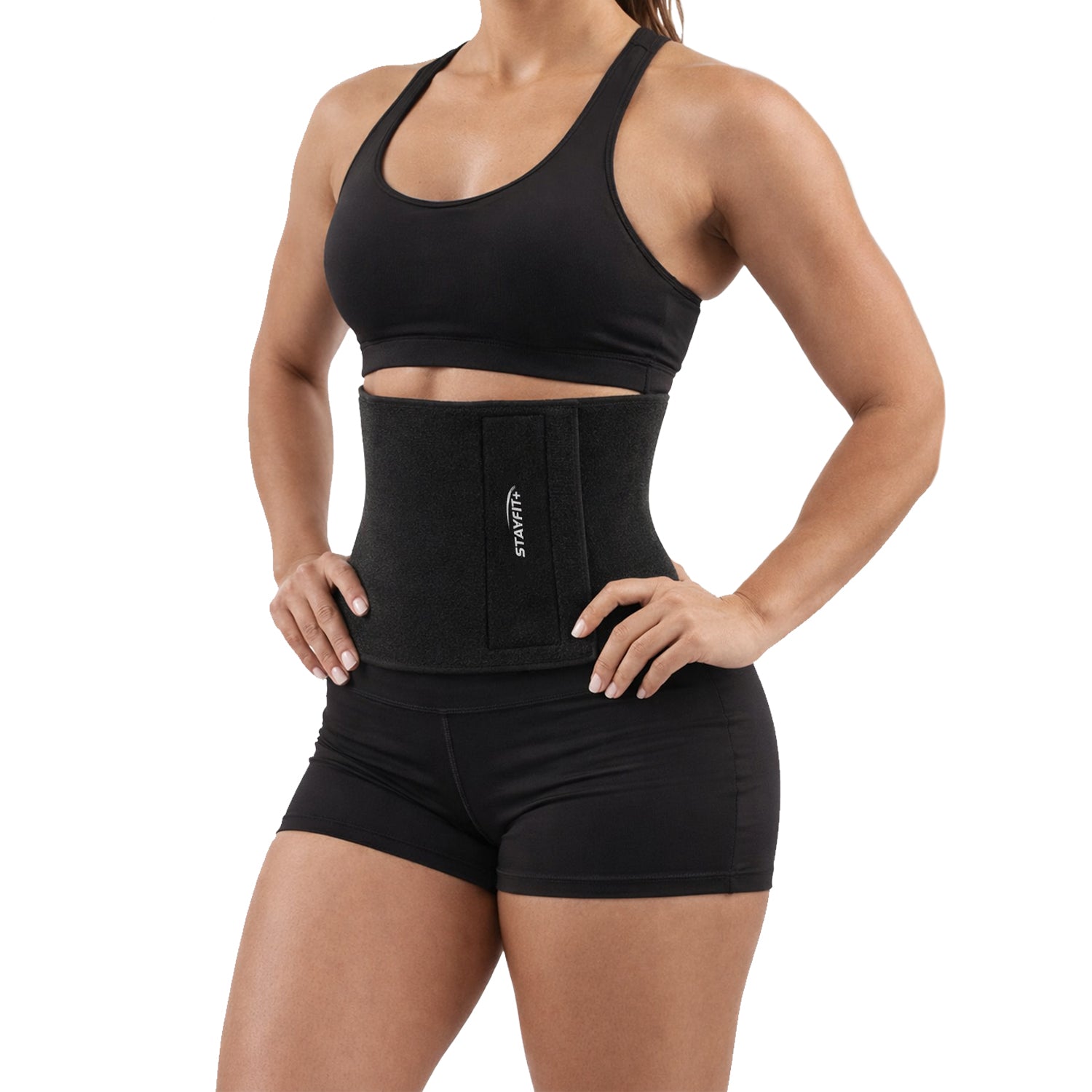 Female athlete wearing a black waist trainer with a white background