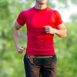 Male athlete on a run outside with a waist pack on