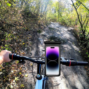 Phone pouch attachment on a bike on a hiking trail