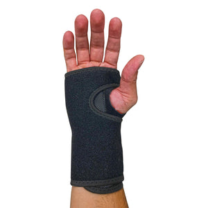 Right hand wearing a carpal tunnel support brace (Palm side up)